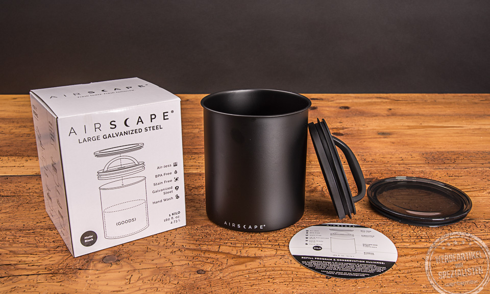 Schwarze Airscape Kaffeedose geöffnet mit Deckel und Verpackung als Werbegeschenk.